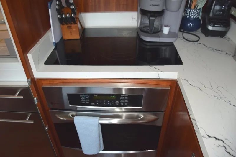Slide: The Image of Full oven and glass cooktop. Subzero refrigerator/freezer drawer to left - 9
