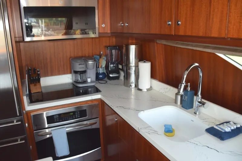 Slide: The Image of Custom Quartz countertops, porcelain sink, and wand faucet - 8