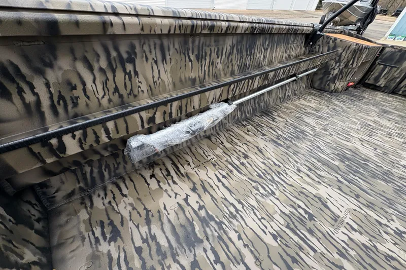 Slide: The Image of Camouflage interior of 2026 Excel 1860 F4 Pro boat, showcasing durable design. - 13