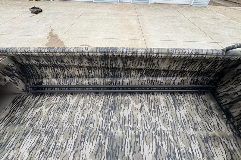 Slide: The Image of Camouflage interior of 2026 Excel 1860 F4 Pro boat on concrete surface. - 14