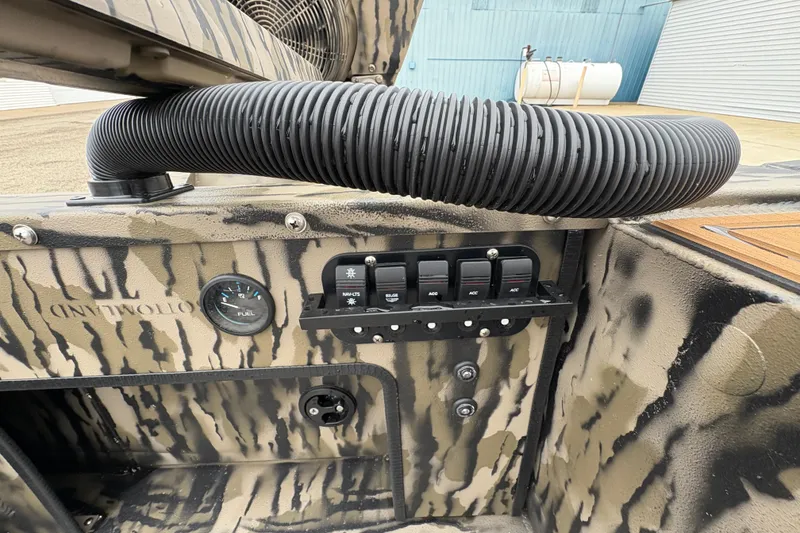 Slide: The Image of Control panel of 2026 Excel 1860 F4 Pro boat with camouflage design. - 19