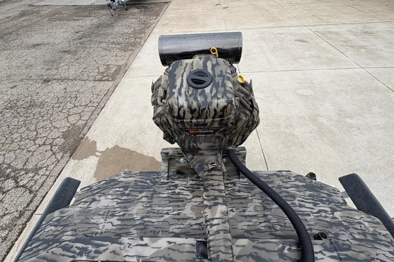 Slide: The Image of Camouflage-patterned Excel 1860 F4 Pro boat engine, 2026 model, on concrete surface. - 21
