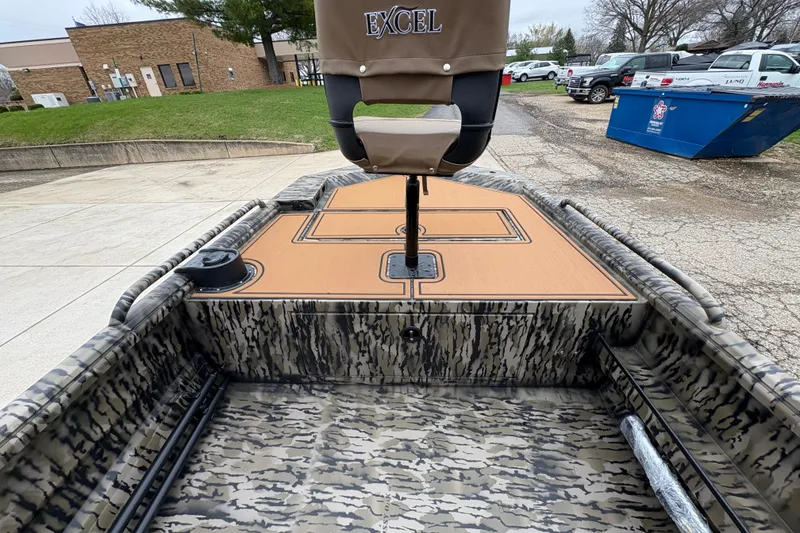Slide: The Image of 2026 Excel 1860 F4 Pro boat with camouflage interior and branded seat. - 9