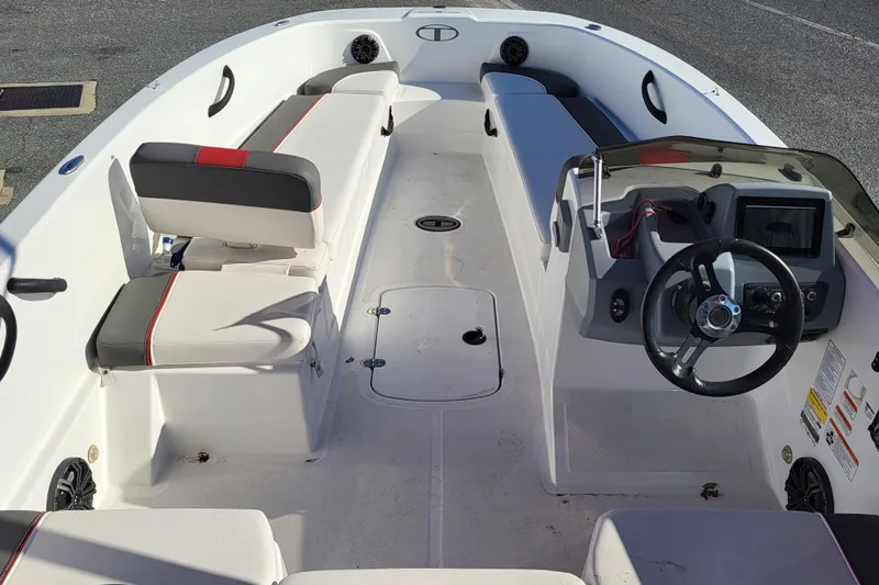 Slide: The Image of 2023 Tahoe T18 boat interior with seating and steering console. - 6