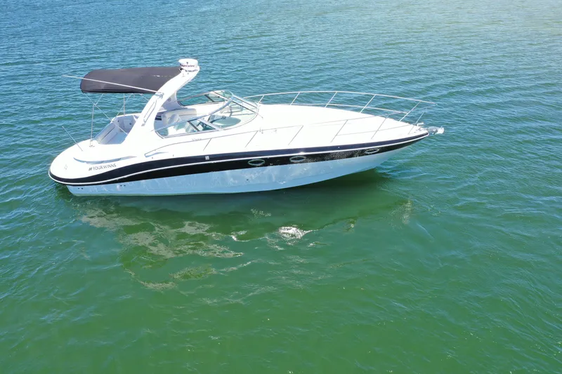 Slide: The Image of 2008 Four Winns V358 boat cruising on clear blue water. - 24