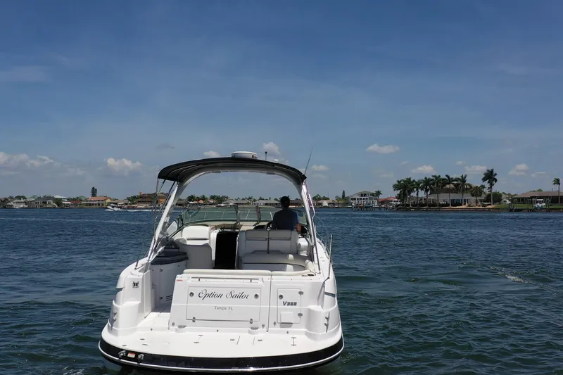 Slide: The Image of 2008 Four Winns V358 boat cruising on a sunny day near coastal homes. - 27