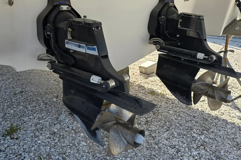 Slide: The Image of 2008 Four Winns V358 boat propellers on gravel surface. - 31