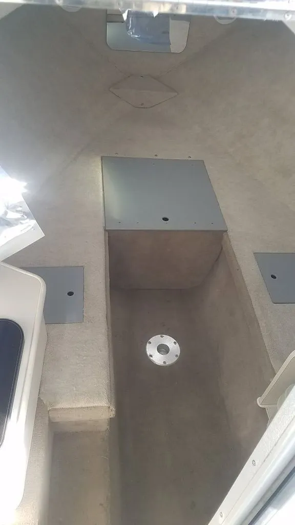 Slide: The Image of Interior of a 2003 Wellcraft 240 Coastal boat, beige upholstery. - 7