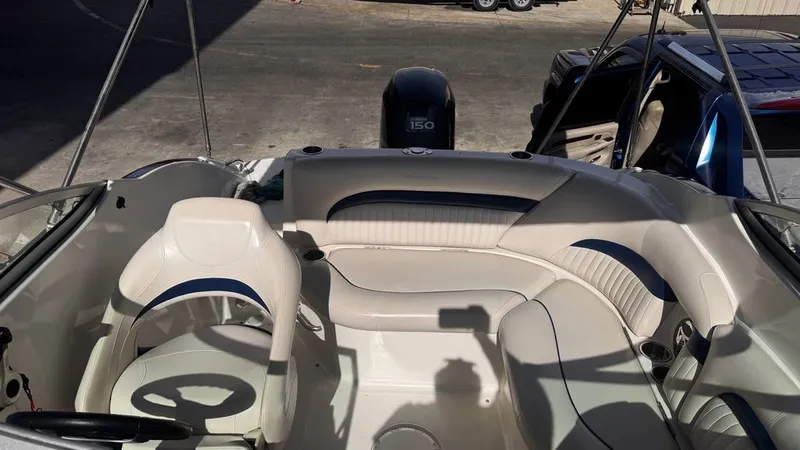 Slide: The Image of Interior of a 2008 Hurricane Sundeck boat with seating area. - 3
