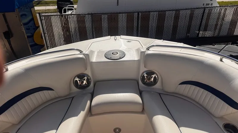 Slide: The Image of Interior of a 2008 Hurricane Sundeck boat with white seating. - 4