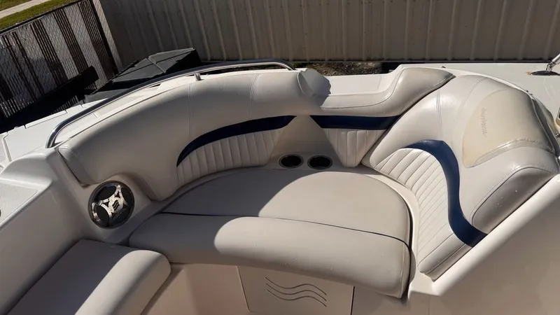 Slide: The Image of Interior of a 2008 Hurricane Sundeck boat with white upholstery. - 5