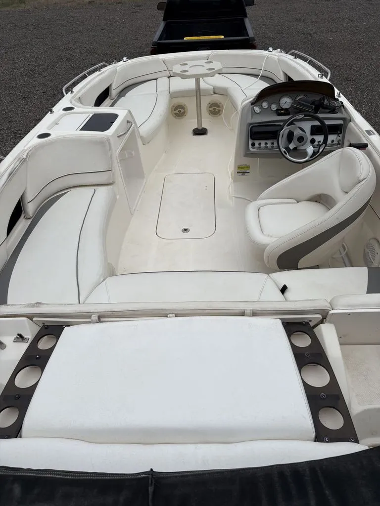 Slide: The Image of Interior view of a 2008 Bayliner Deck Boat 217SD with white seating. - 2