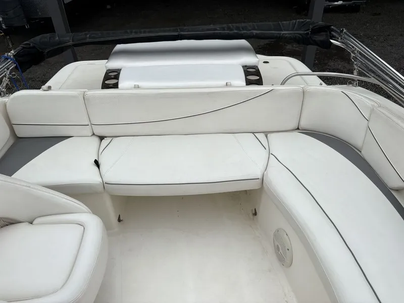 Slide: The Image of Interior of a 2008 Bayliner Deck Boat 217SD with white seating. - 4