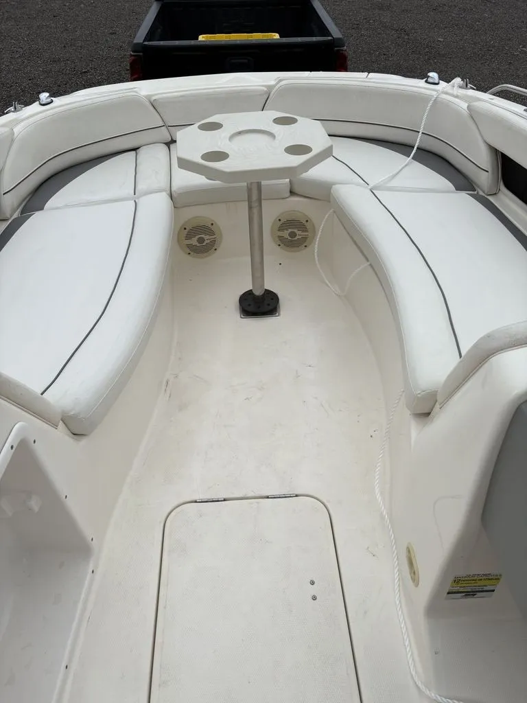 Slide: The Image of Interior view of a 2008 Bayliner Deck Boat 217SD with seating area. - 5