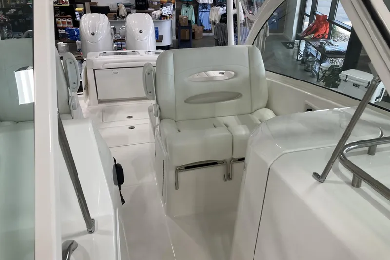 Slide: The Image of 2026 Albemarle 27 Dual Console boat interior with white seating and modern design. - 13