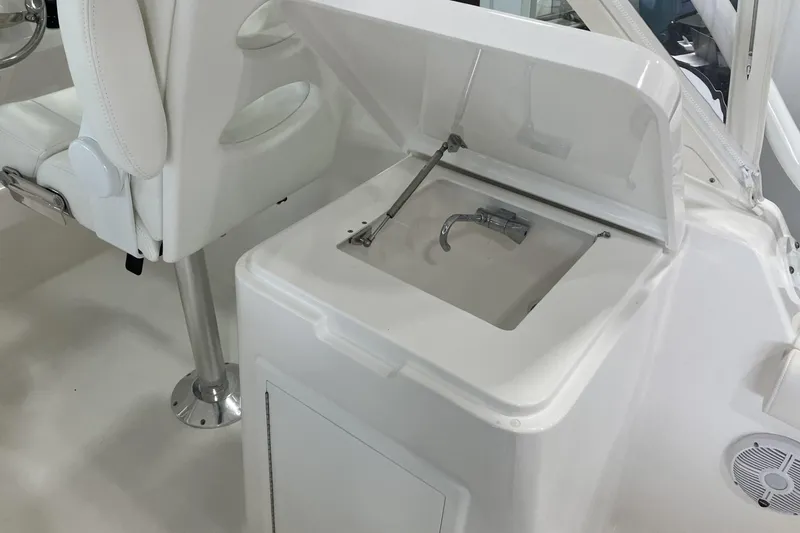 Slide: The Image of 2026 Albemarle 27 Dual Console boat interior with open storage compartment and seating. - 7