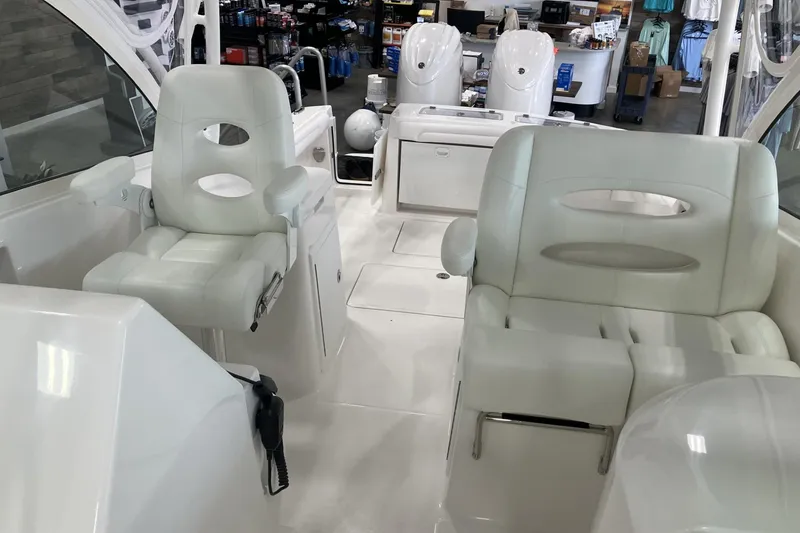 Slide: The Image of 2026 Albemarle 27 Dual Console boat interior with white seating and modern design. - 9