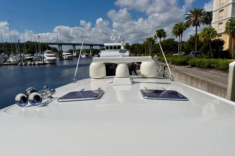 Slide: The Image of 2016 Sabre 48 Salon Express yacht docked at marina under blue sky. - 20