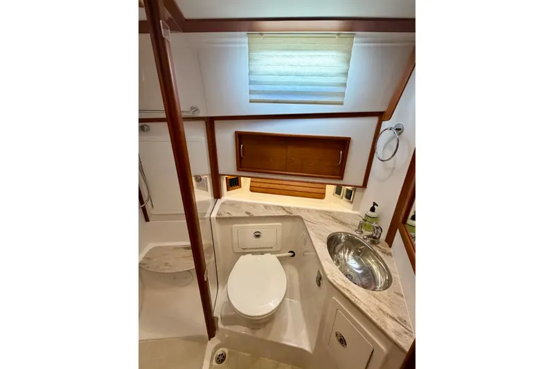 Slide: The Image of Luxurious bathroom in 2016 Sabre 48 Salon Express yacht with modern fixtures. - 27