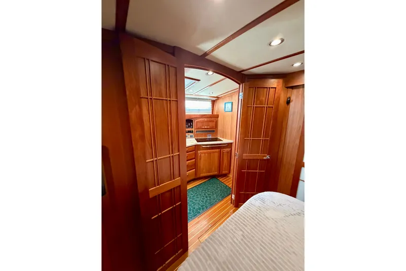Slide: The Image of Interior of 2016 Sabre 48 Salon Express yacht with wooden cabinetry and cozy design. - 31