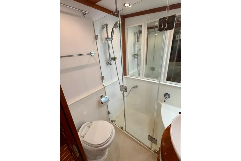 Slide: The Image of Bathroom interior of 2016 Sabre 48 Salon Express yacht with glass shower enclosure. - 34