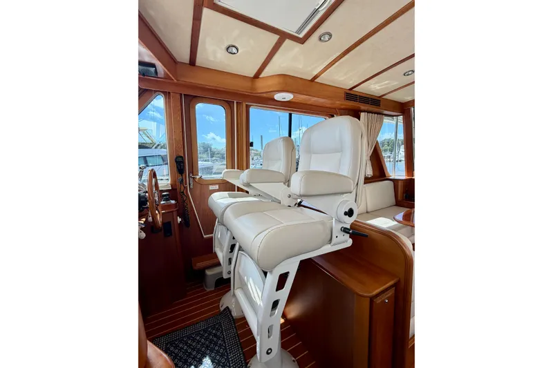 Slide: The Image of Interior of 2016 Sabre 48 Salon Express yacht with luxurious seating and wooden accents. - 39