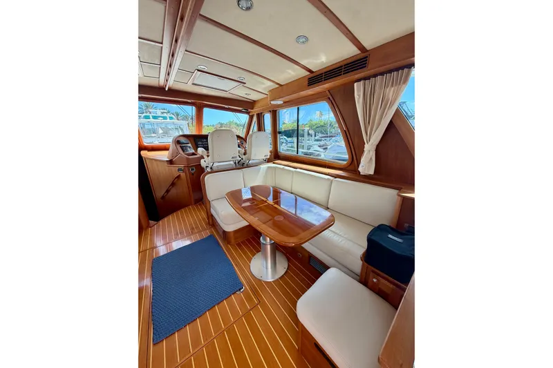 Slide: The Image of Interior of 2016 Sabre 48 Salon Express yacht with elegant wood finish and seating area. - 43