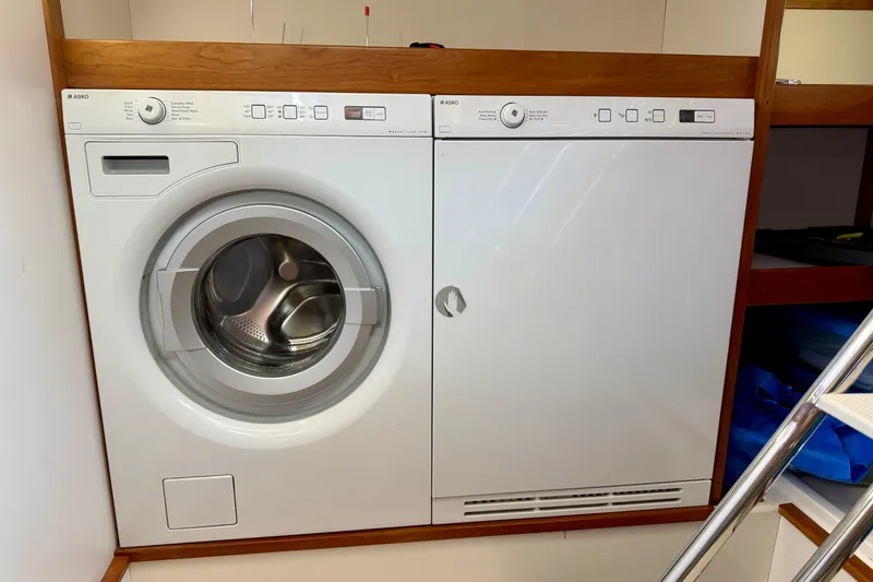 Slide: The Image of Laundry appliances inside a 2016 Sabre 48 Salon Express yacht. - 52