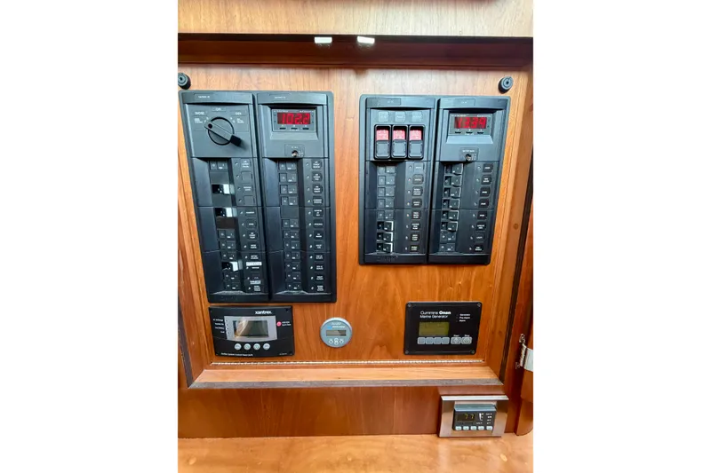 Slide: The Image of Electrical control panel on 2016 Sabre 48 Salon Express yacht interior. - 54