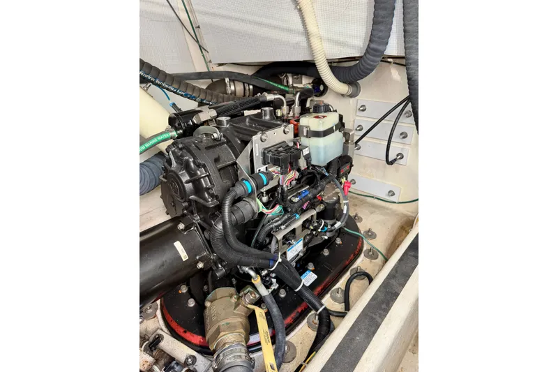 Slide: The Image of Engine compartment of 2016 Sabre 48 Salon Express, showcasing detailed mechanical components. - 56