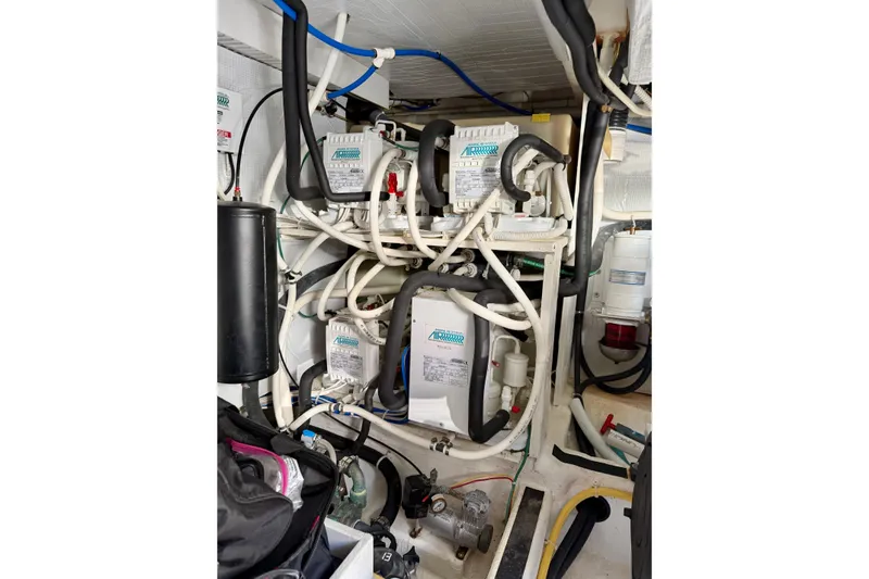Slide: The Image of Engine room of 2016 Sabre 48 Salon Express with complex wiring and machinery. - 58