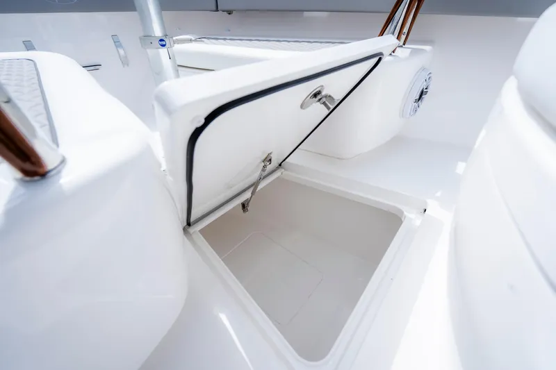 Slide: The Image of Open storage compartment on 2025 Valhalla Boatworks V-33, showcasing sleek design and functionality. - 16