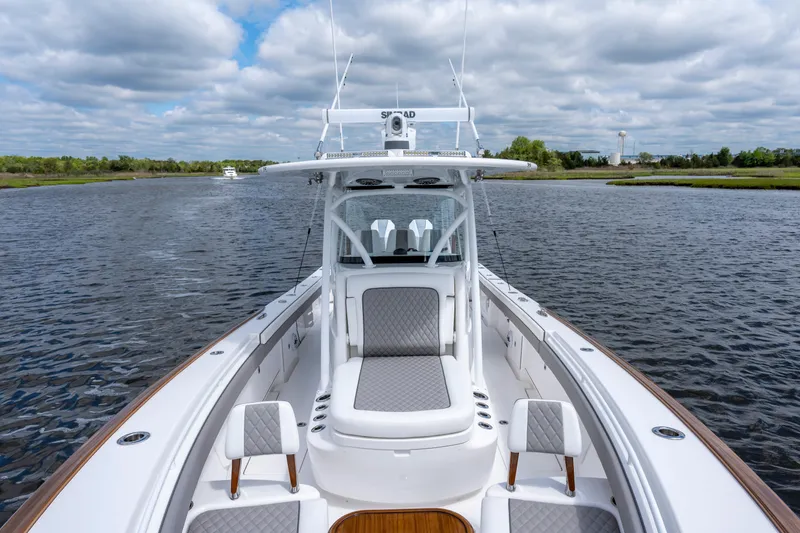 Slide: The Image of 2025 Valhalla Boatworks V-33 on calm water under a cloudy sky. - 17