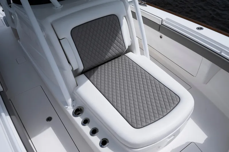 Slide: The Image of 2025 Valhalla Boatworks V-33 with quilted gray seating and sleek white deck design. - 21