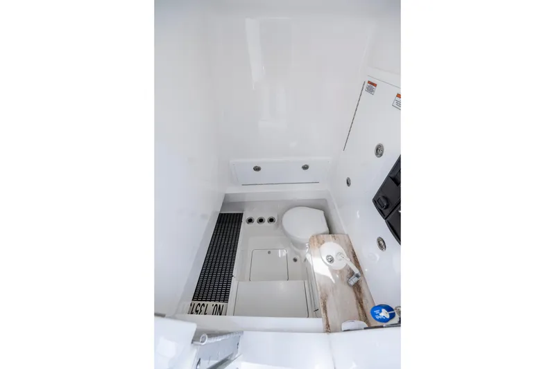 Slide: The Image of 2025 Valhalla Boatworks V-33 interior cabin with toilet and storage compartments. - 22