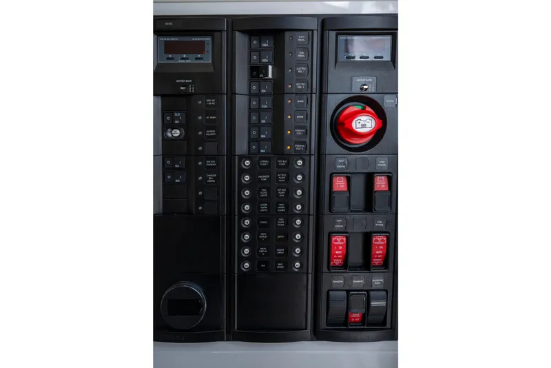 Slide: The Image of Control panel of 2025 Valhalla Boatworks V-33, featuring switches and gauges. - 23
