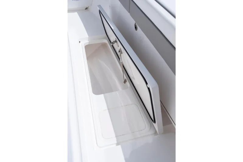 Slide: The Image of Open storage compartment on 2025 Valhalla Boatworks V-33 boat. - 26