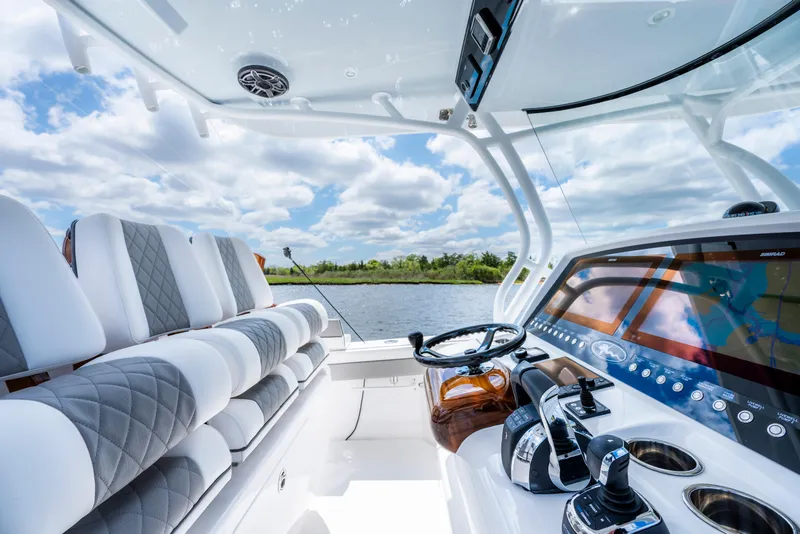 Slide: The Image of Interior view of 2025 Valhalla Boatworks V-33, featuring modern helm and seating. - 32