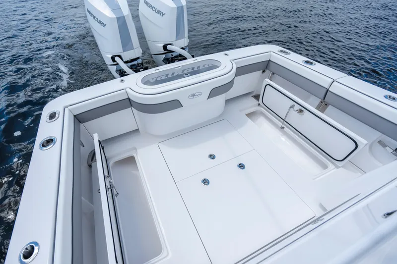 Slide: The Image of 2025 Valhalla Boatworks V-33 deck with twin Mercury engines on water. - 35