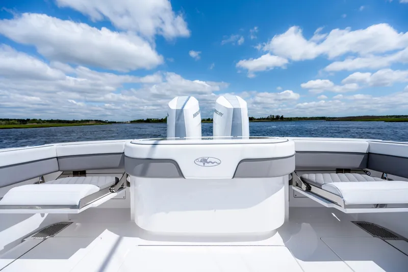 Slide: The Image of 2025 Valhalla Boatworks V-33 on water, showcasing sleek design and twin engines. - 37