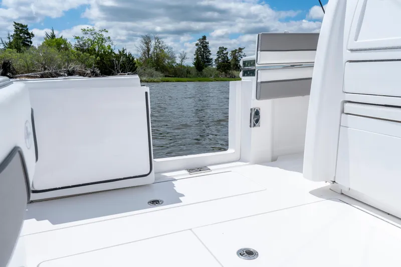 Slide: The Image of 2025 Valhalla Boatworks V-33 interior with open deck view, near serene water. - 39