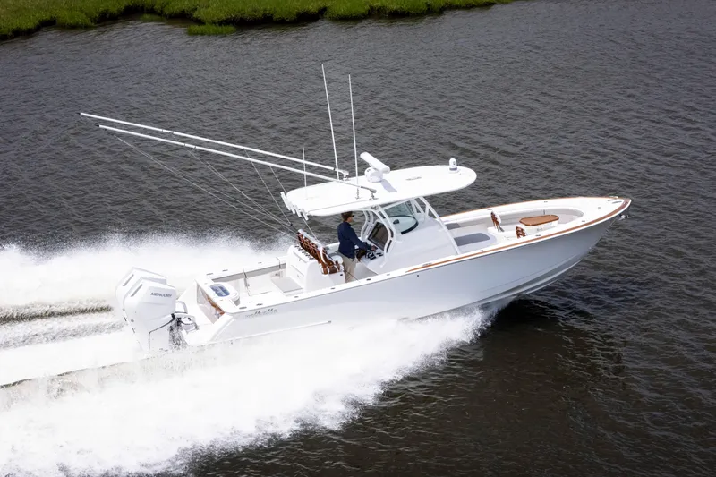 Slide: The Image of 2025 Valhalla Boatworks V-33 cruising on water, showcasing sleek design and powerful performance. - 5