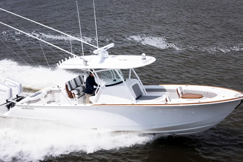 Slide: The Image of 2025 Valhalla Boatworks V-33 cruising on open water, showcasing sleek design and performance. - 6