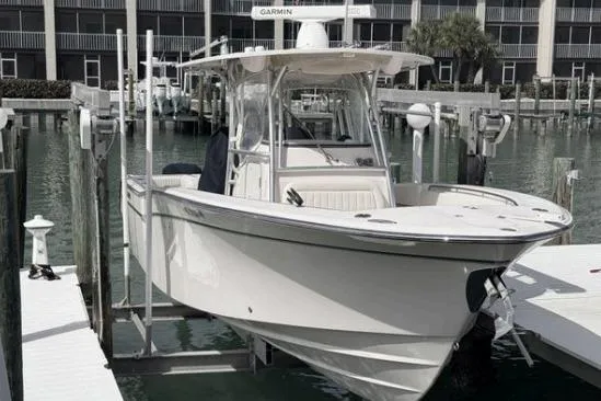 Slide: The Image of 2014 Grady-White Canyon 306 boat docked at marina with Garmin equipment. - 1