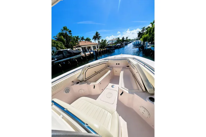 Slide: The Image of 2014 Grady-White Canyon 306 boat interior with canal view, sunny day. - 11