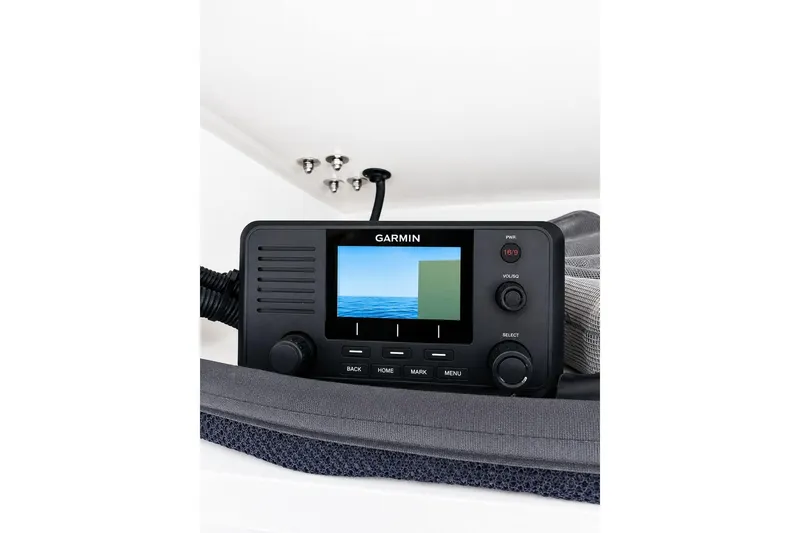 Slide: The Image of Garmin marine radio on 2014 Grady-White Canyon 306 boat dashboard. - 15
