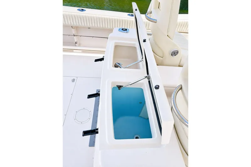 Slide: The Image of 2014 Grady-White Canyon 306 boat with open storage compartments on deck. - 16