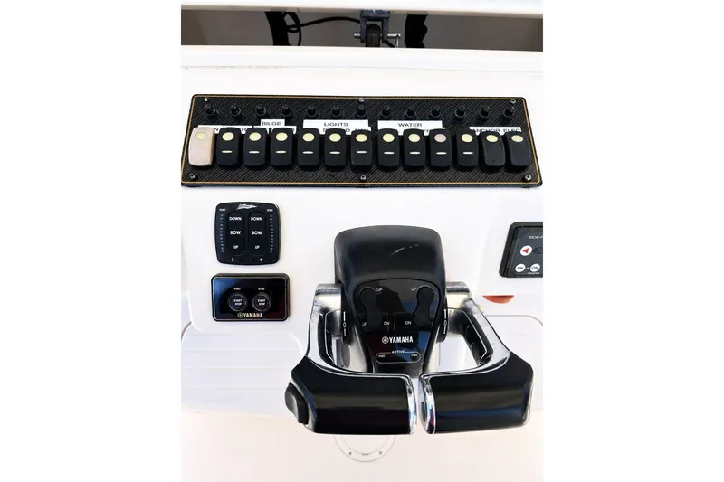 Slide: The Image of Control panel of 2014 Grady-White Canyon 306 boat with Yamaha throttle. - 17