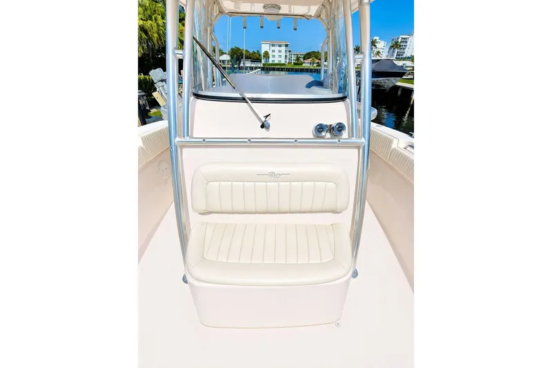 Slide: The Image of 2014 Grady-White Canyon 306 boat interior with cushioned seating and sleek design. - 21