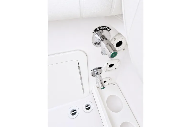 Slide: The Image of Freshwater and raw water outlets on 2014 Grady-White Canyon 306 boat. - 25